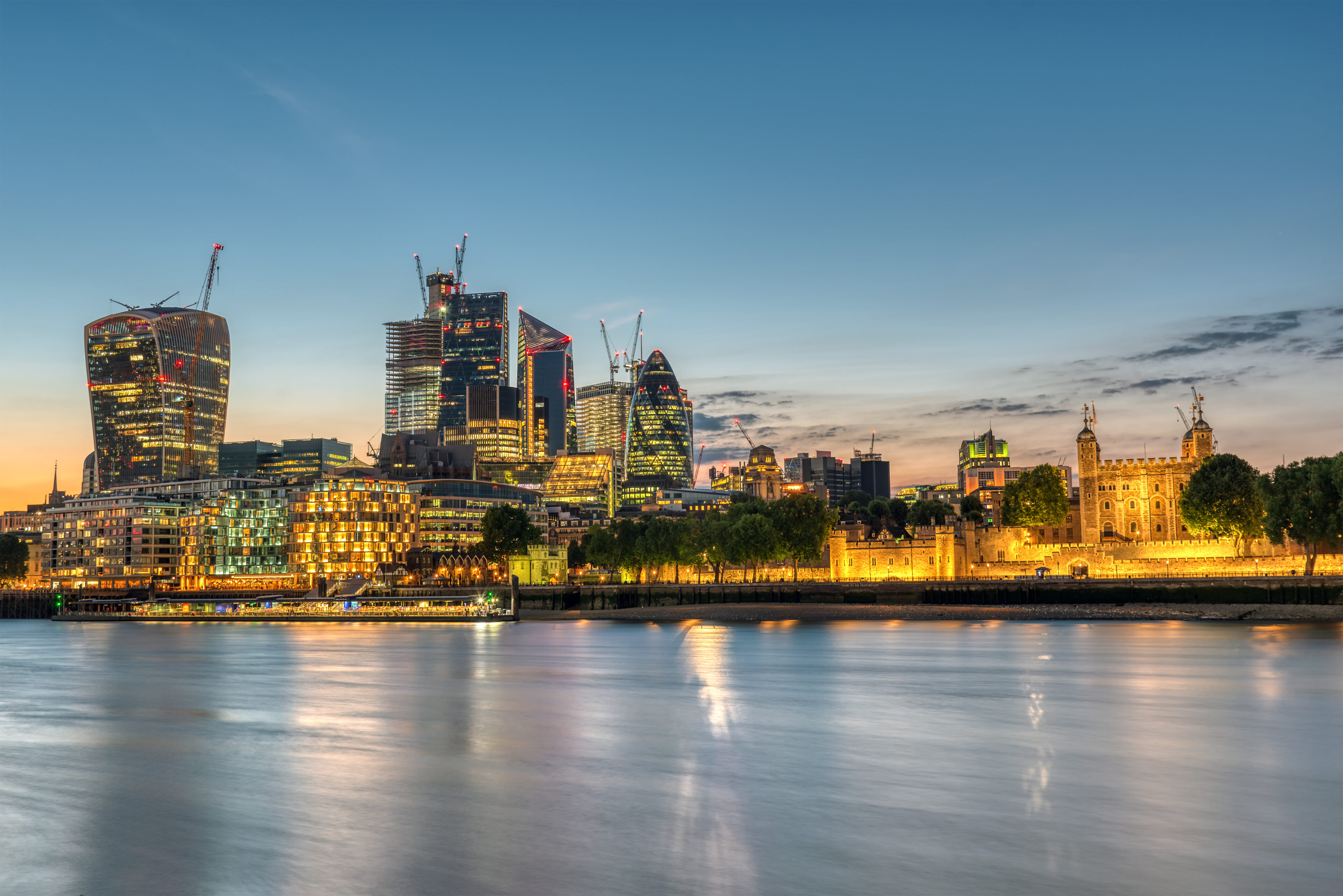 The City of London at blue hour across the Thames
