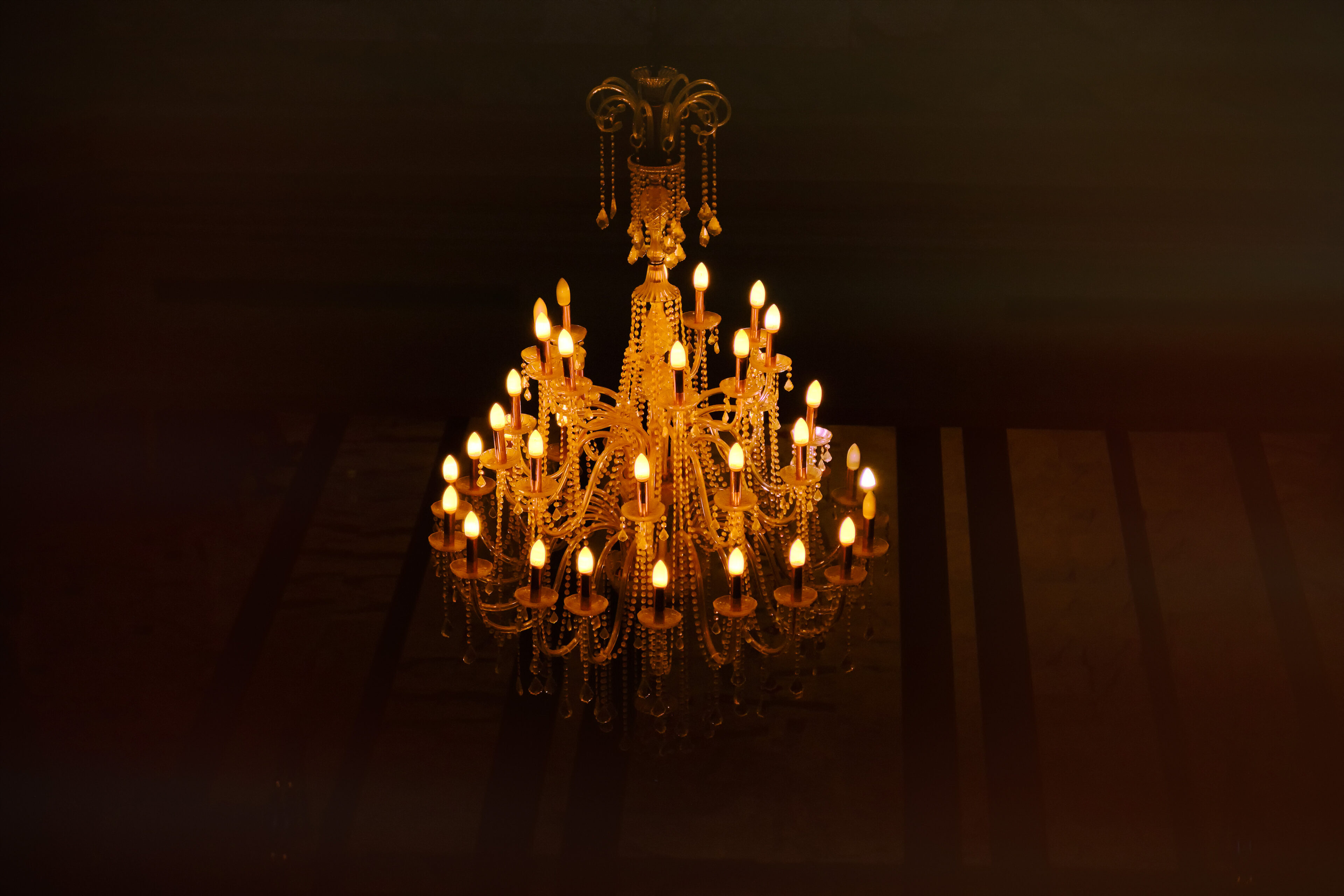 Golden chandelier in a dark interior