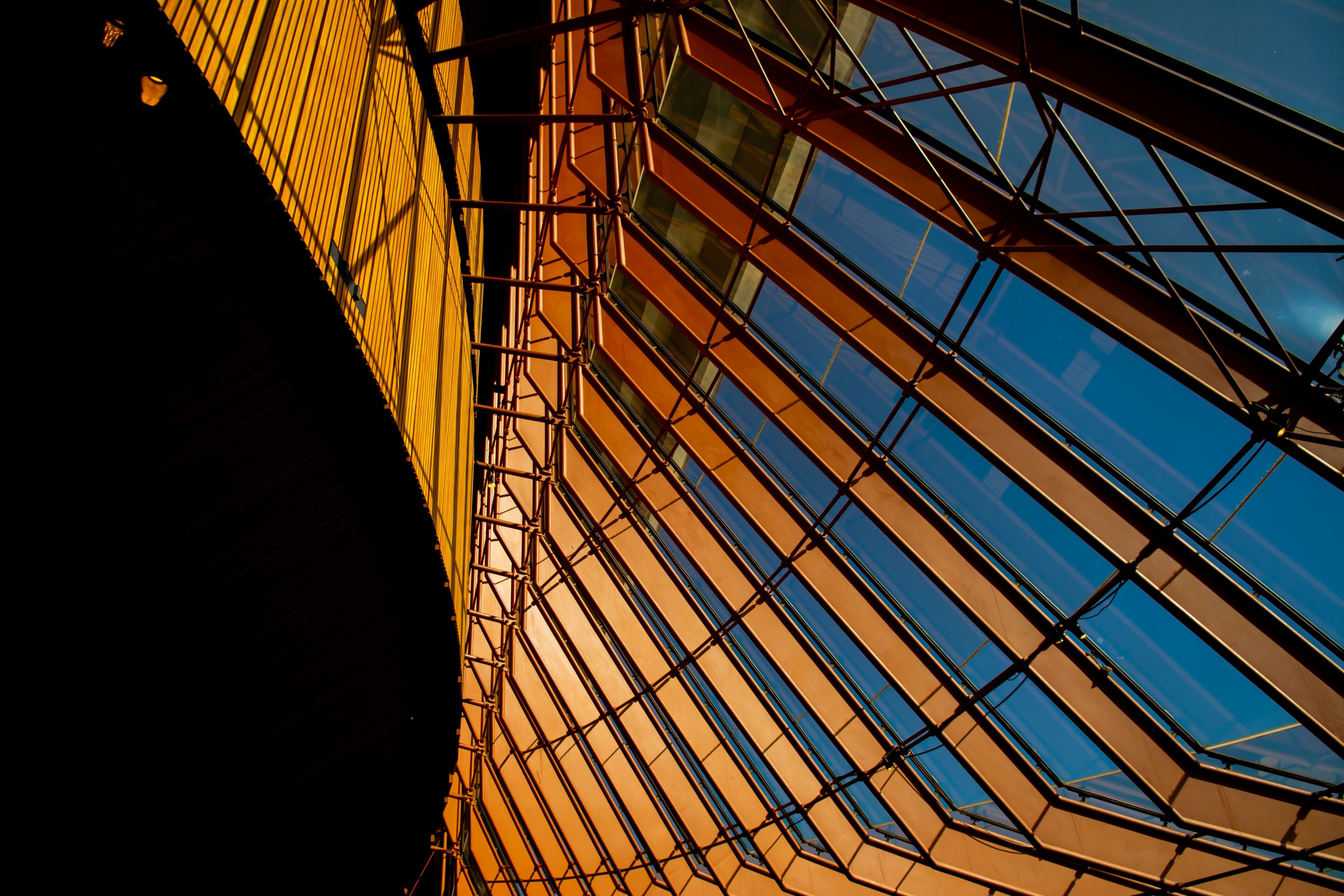 Steel and glass lattice in warm light